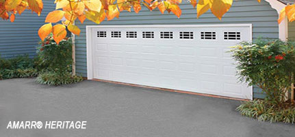 A garage that has a white door and gray wall